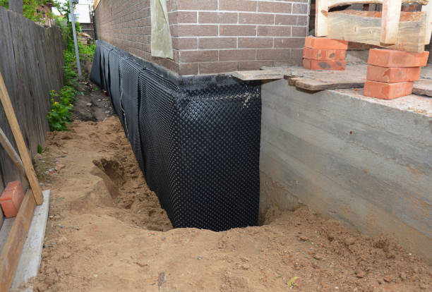 Happy homeowners after waterproofing job in Alamo